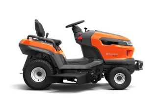 Side view of a Husqvarna ride-on mower with visible cutting deck.