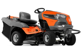 Husqvarna TC 138T. Side view of a Husqvarna ride-on mower with grass collection attachment.