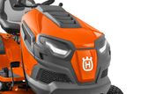 Front view of a Husqvarna ride-on mower showcasing its headlights and design.