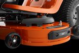 Close-up view of a lawn mower cutting deck with wheels and blade guard.