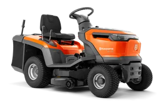 Side view of a Husqvarna ride-on lawn mower with visible steering wheel and seat.