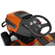 Close-up view of the control panel and steering wheel of a Husqvarna ride-on mower.