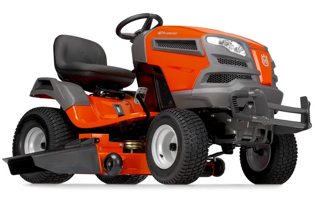 Side view of a Husqvarna ride-on lawn mower with visible cutting deck.
