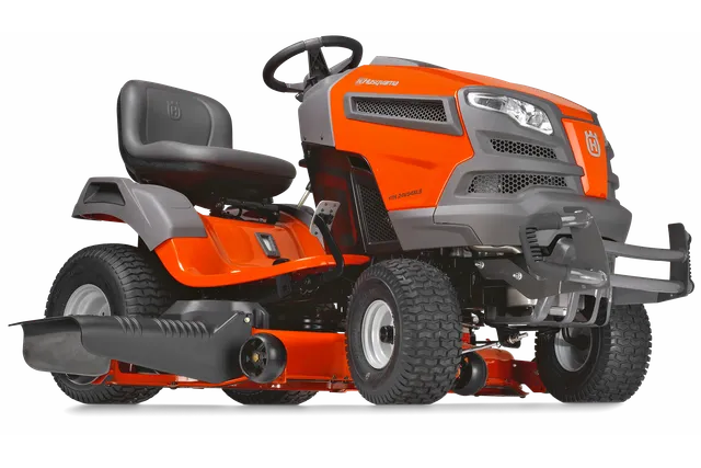 Side view of a Husqvarna ride-on lawn mower showcasing its design and features.