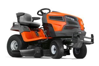 Side view of a Husqvarna ride-on mower with a comfortable seat and steering wheel.