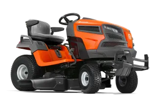 Side view of a Husqvarna ride-on mower with a comfortable seat and steering wheel.