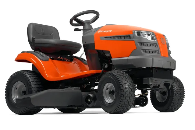 Vue latérale d’une tondeuse autoportée Husqvarna.