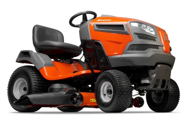 Side view of a Husqvarna ride-on lawn mower with cutting deck.