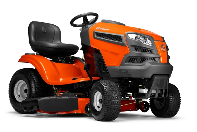 Side view of a Husqvarna ride-on lawn mower with visible cutting deck.