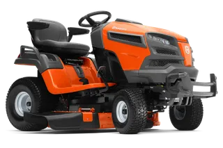 Side view of a Husqvarna ride-on mower showcasing its design and cutting deck.