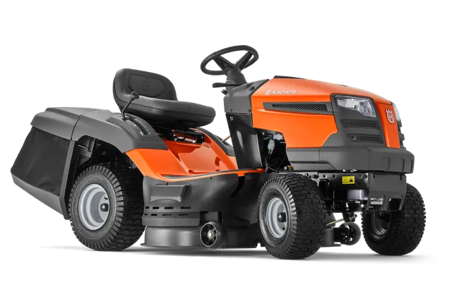 Zijaanzicht van een Husqvarna zitmaaier met maaidek.