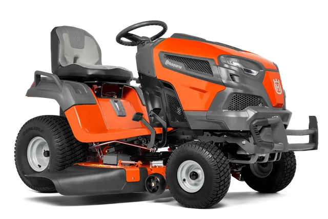 Вид збоку на газонокосарку-трактор Husqvarna.