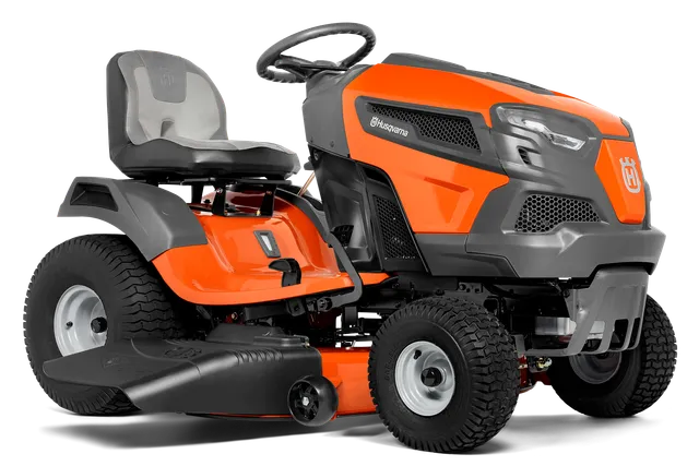 Side view of a Husqvarna ride-on lawn mower with visible cutting deck.