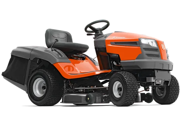 Вид збоку на косарку-трактор Husqvarna з видимою різальною декою.