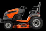 Side view of a Husqvarna ride-on mower with cutting deck.