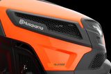 Close-up of a Husqvarna TS 275XD mower front with visible branding and grille design.