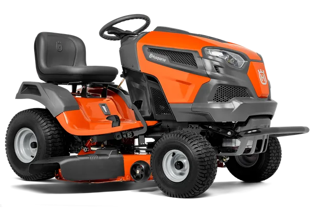 Side view of a Husqvarna ride-on lawn mower with visible cutting deck.