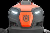 Front view of a Husqvarna ride-on mower showcasing the headlights and grill design.