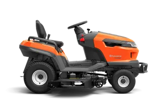 Side view of a Husqvarna ride-on mower with visible cutting deck.