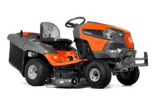 Side view of a Husqvarna ride-on lawn mower with visible cutting deck.