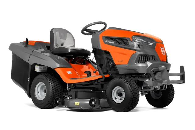 Side view of a Husqvarna ride-on lawn mower with visible cutting deck.