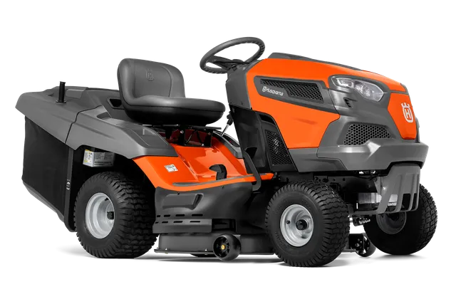 Вид збоку на газонокосарку-трактор Husqvarna з різальною декою.