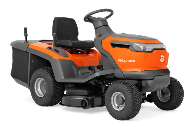 Sivunäkymä Husqvarnan ajettavasta ruohonleikkurista, jossa on leikkuulaite.