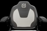 Front view of a Husqvarna seat with armrests, showcasing the brand logo on the backrest.