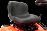 Close-up of a Husqvarna ride-on mower seat and steering area.
