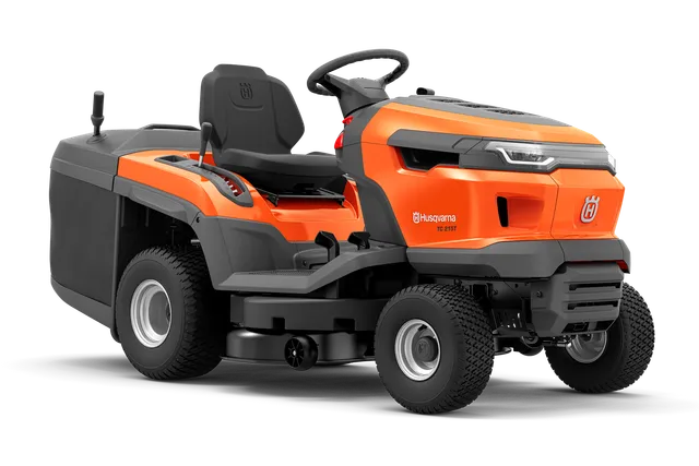 Вид збоку на косарку-трактор Husqvarna з різальною декою.