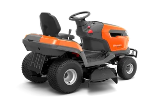 Side view of a ride-on lawn mower with visible steering wheel and seat.