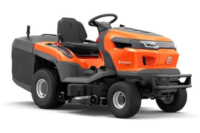 Side view of a Husqvarna ride-on mower with cutting deck.