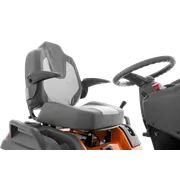 Close-up view of a Husqvarna ride-on mower seat and steering wheel.