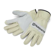 Paire de gants de travail Husqvarna avec paumes renforcées, disposés dans un studio.