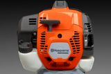 Front view of a Husqvarna professional engine unit.