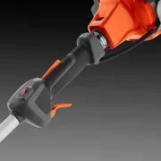Close-up view of a trimmer handle with ergonomic grip and control switches.