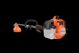 Side view of a Husqvarna grass trimmer with visible engine and cutting head.