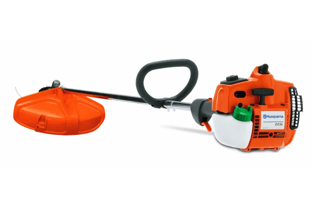 Side view of a Husqvarna grass trimmer with ergonomic handle and protective guard.