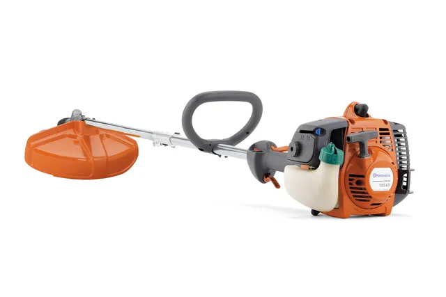 Side view of a Husqvarna brushcutter with ergonomic handle and visible engine components.