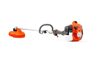 Side view of a Husqvarna grass trimmer with ergonomic handle and engine.