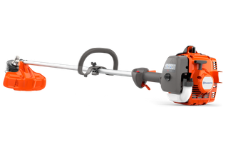 Side view of a Husqvarna string trimmer with ergonomic handle and visible engine.