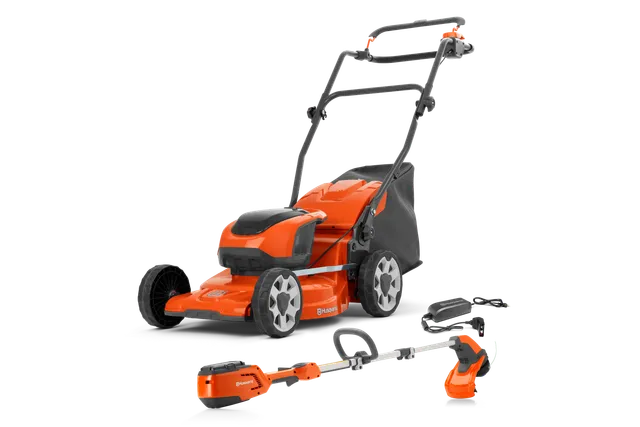 HUSQVARNA LC 137i/115iL. Edestä view Husqvarna-ruohonleikkuri ja ruohotrimmeri laturilla.