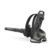 Side view of a Husqvarna leaf blower with open battery compartment.