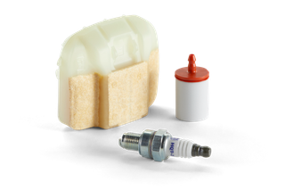 Top view of a spark plug, fuel filter, and air filter for garden equipment.