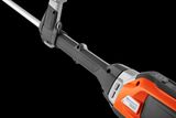 Close-up van een Husqvarna-product met ergonomisch handvat.