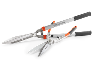 Front view of Husqvarna hedge shears with ergonomic handles.