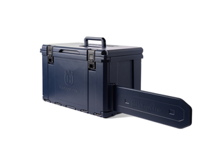 Side view of a Husqvarna storage box with a chainsaw guide bar attachment.