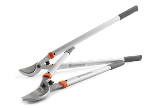 Side view of two Husqvarna loppers with long handles and sharp blades.
