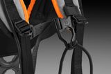 Close-up view of a harness with adjustable straps and chaest buckle.