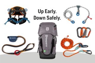 A collection of Husqvarna climbing gear including a harness, backpack, ropes, and carabiners.